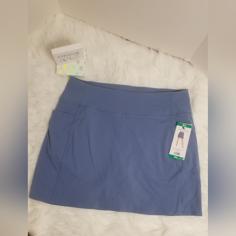 Its a very cute sports skirt super streachy and it has biker shorts under